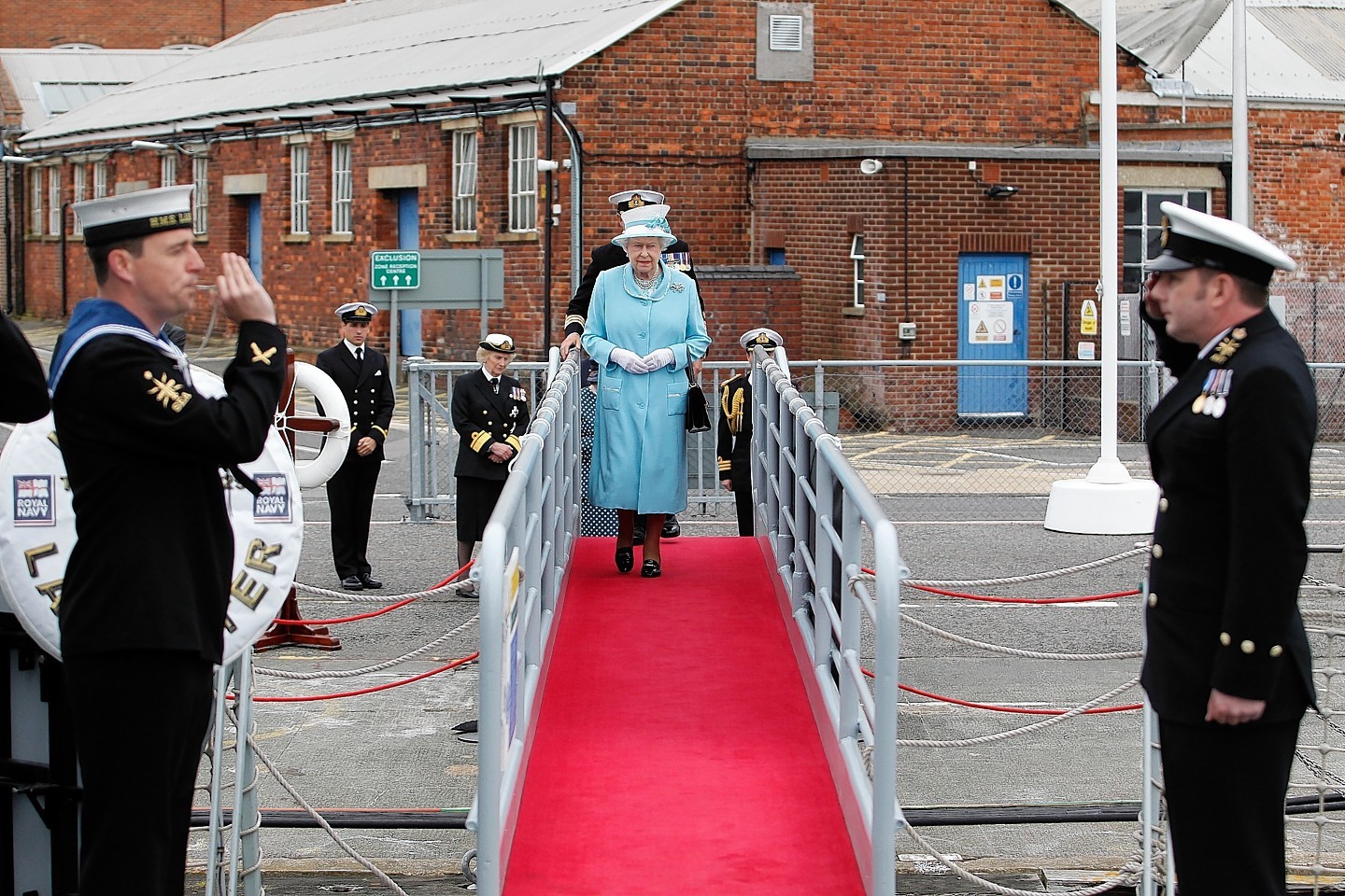  Queen Elizabeth II receives a Royal Salute during a visit to HMS Lancaster at Portsmouth Naval Base, Hampshire